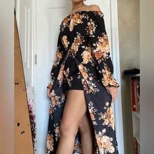 Black and Orange floral romper with skirt/slit. Never been worn before!